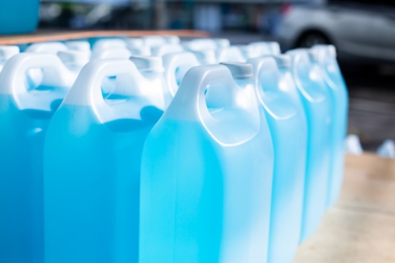 a row of blue plastic containers with white handles